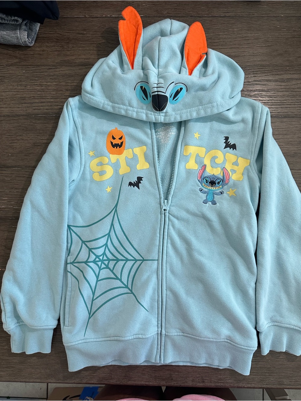 Disney Light Blue Stitch Halloween Hoodie with Orange Ear Accents kids size L